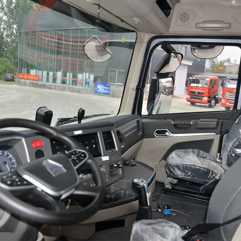 Spacious and modern driver cabin of a Sinotruk Sitrak truck featuring ergonomic dashboard layout